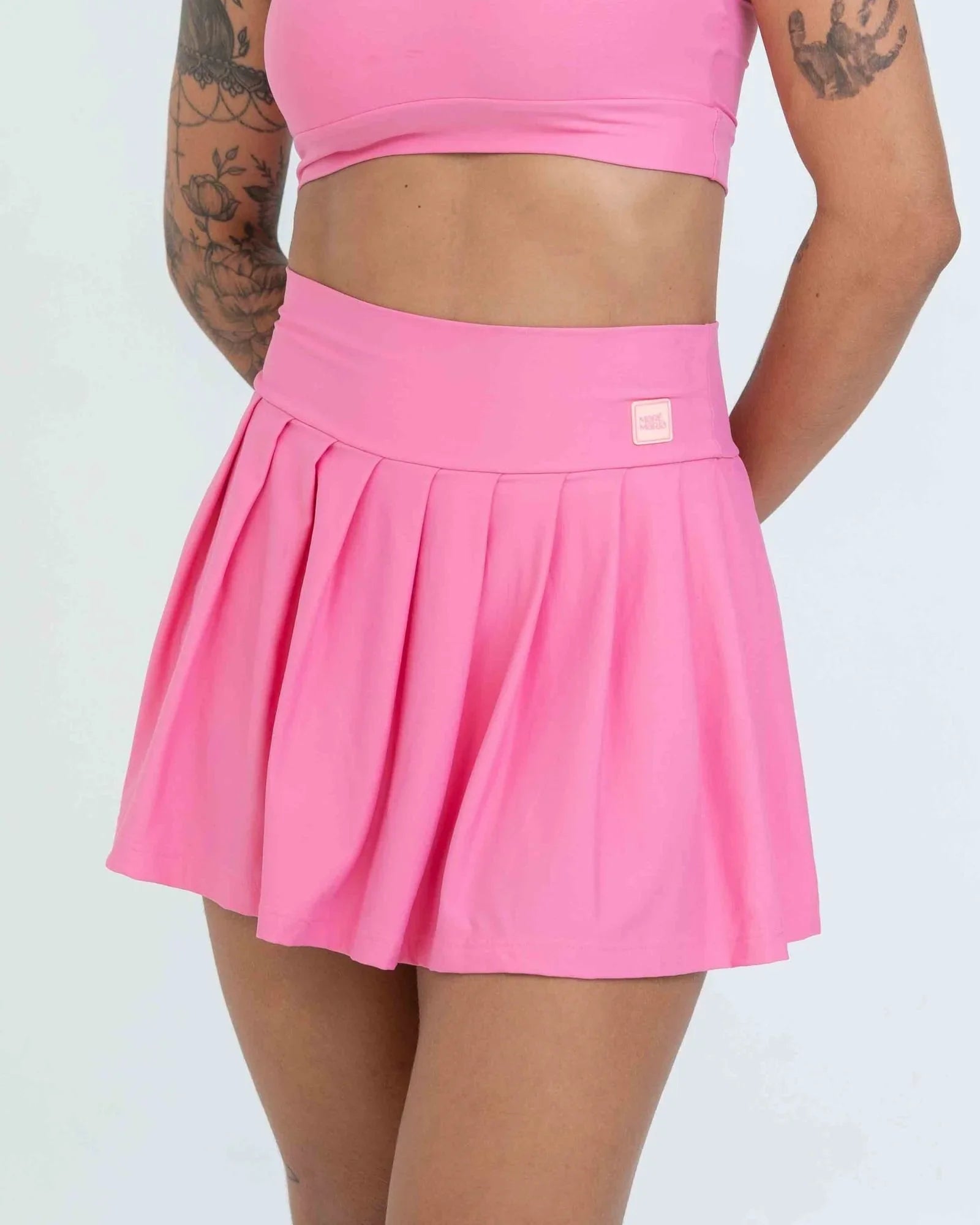 Short Saia Fitness Plissada Rosa Malibu